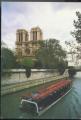 CPM  PARIS  Notre Dame, La Seine et le Bateau Mouche