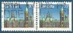 Canada paire de N1030a Parlement oblitr (dentels sur 3 cts)