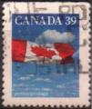 Canada 1990 - Drapeau du Canada sur ciel nuageux, ND haut - YT 1123b 